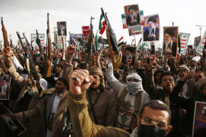 Pro-Iran protesters brandish billboards flags of Yemen and Iran, weapons, and chant slogans as they take part in a rally held to condemn the US-Israel aerial attacks on Iran and killing the Iranian Supreme leader and several military officials on March 1, 2026 in Sana'a, Yemen. 