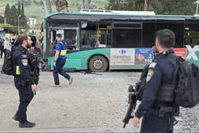 Security forces inspect Egged bus following a rocket shrapnel impact in Kiryat Shmona on March 23, 2026.