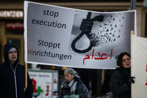 Protesters display a banner calling for a halt to executions in Iran during a rally in Berlin, Germany, on January 10, 2026, in support of the Iran protests.