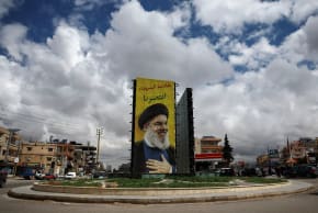 A BANNER with an image of late Hezbollah leader Hassan Nasrallah hangs on a roundabout, following an escalation between Hezbollah and Israel, amid the US-Israeli conflict with Iran, in Baalbek, Lebanon, March 23, 2026.
