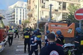 Emergency responders at the scene of shrapnel hitting central Israel, March 24, 2026.