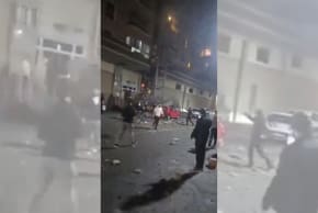 People stand amidst debris following an attack on a building in Erbil, Iraq, in this screengrab obtained from a social media video released March 25, 2026.