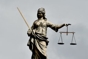 An illustrative image of a statue of Lady Justice.