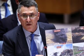 Israeli Foreign Minister Gideon Saar shows photos as he speaks during a United Nations Security Council meeting on the Middle East at UN headquarters in New York on February 18, 2026.