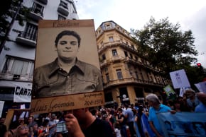 A man holds up a portrait of Luis German Cirigliano, who disappeared during Argentina's 'Dirty war', during a demonstration to commemorate the 40th anniversary of the 1976 military coup in Buenos Aires, March 24, 2016.