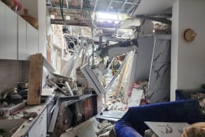 Damage after Iranian missile fragments hit a residence in the Tel Aviv area, March 26, 2026.