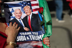 ‘WHATEVER TRUMP’S plans, Israel can emerge from this war with a great diplomatic prize.’ Here, a person holds a sign supporting Prime Minister Benjamin Netanyahu and US President Donald Trump during a gathering of Iranian community members showing support for Israel and the US, earlier this month.