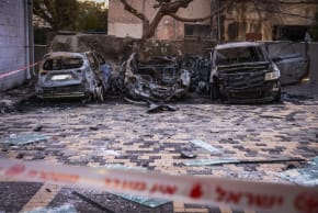 Israeli srcurity and rescue forces inspect the damage at the scene where a missile fired from Iran toward Israel caused damage in Nahariya, March 26, 2026.