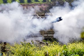 Smoke is released after an Israeli army self-propelled Howitzer artillery gun fires rounds from the upper Galilee in northern Israel near the border with southern Lebanon on March 27, 2026.