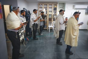 Prayer in a Safed bomb shelter.