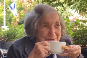 Mrs. Glassman enjoys a cup of coffee at one of the Jerusalem cafés she frequented