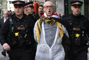 An activist from People Against Genocide is arrested after being freed from a lock-on device during the protest on March 30, 2026 in London, England.
