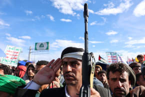 A protester salutes as Houthi supporters demonstrate in solidarity with Iran, in Sana'a, Yemen, March 27, 2026
