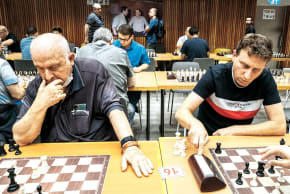 Yedael Stepak is pictured above with his son Eran beside a chessboard.