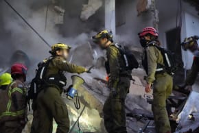 IDF rescue services seen at the scene of an impact site in Haifa, April 6, 2026.