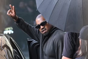 US rapper and producer Kanye West gestures upon arriving at Shanghai Pudong International Airport on July 11, 2025.