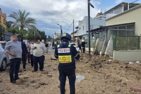 Magen David Adom paramedics at the scene of shrapnel hitting near a residence in central Israel, April 7, 2026.