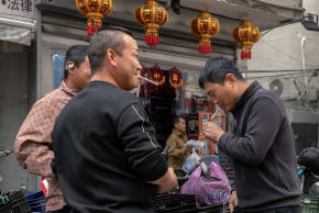 Foreign workers from China in preparations for the upcoming Chinese New Year, in the south Tel Aviv neighborhood of Neve Shanaan. February 14, 2026.