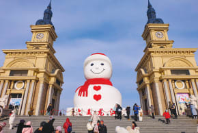 CHINA’S ‘ICE CITY’: The giant snowman at Harbin Musical Park, a city landmark. Tourists enjoy Harbin’s Ice and Snow World (L) and the International Ice and Snow Sculpture Festival. 