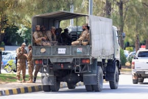 Army soldiers sit in a truck, as Pakistan prepares to host the US and Iran for peace talks, in Islamabad, Pakistan, April 10, 2026.