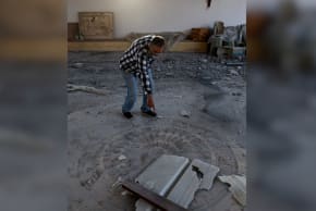 A man inspects the site of the remains of a Byzantine church, which was damaged after a barrage of projectiles was launched towards Israel from Iran-backed Hezbollah in Lebanon, in Nahariya, northern Israel, April 10, 2026. 