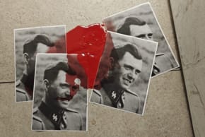 Photos of Nazis with red paint left at the entrance to the Haifa District Health Bureau.