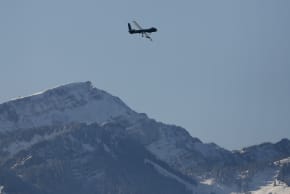 The Israeli Elbit Systems Ltd. Hermes 900 unmanned aerial vehicle (UAV) flies over the airbase during a media presentation in the central Swiss town of Emmen 