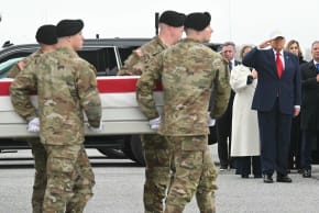 Members of a US Army team carry a flagged-drapped transfer case containing the remains of US soldier Capt. Cody A. Khork during a dignified transfer solemn event at Dover Air Force Base, in Dover, Delaware, on March 7, 2026.