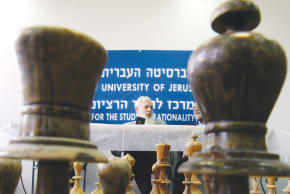 Prof. Yisrael Aumann speaks at a Nov. 2005 news conference at the Hebrew University, after winning the  Nobel Prize in Economics for his work on conflict and cooperation through game theory analysis. He shares the  prize with American economist Thomas Schelling.