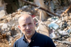 Naftali Bennett at the scene where a ballistic missile fired from Iran hit Tel Aviv overnight, causing heavy damage, March 1, 2026. 