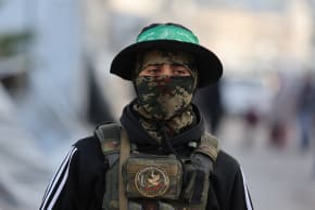 A HAMAS terrorist stands on a street during Eid al-Fitr in Gaza City.