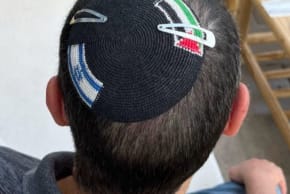 A KIPPAH with both an Israeli and Palestinian flag on it.