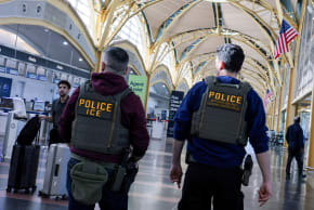 US Immigration and Customs Enforcement (ICE) agents patrol at Washington Reagan National Airport in Arlington, Virginia, US, March 24, 2026.