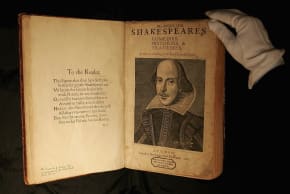 File Photo: A Sothebys employee handles a copy of William Shakespeare, The First Folio 1623  in London, England, July 7, 2006.