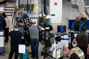 A US Immigration and Customs Enforcement (ICE) agent patrols a TSA security checkpoint in Baltimore/Washington International Thurgood Marshall Airport (BWI) in Baltimore, Maryland, US, March 29, 2026. 