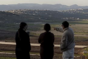 Israelis look at the border with Lebanon from a position in the northern village of Metula, near the border with Lebanon on March 5, 2026. 