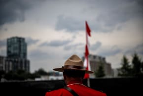 An officer of the Royal Canadian Mounted Police (RCMP) looks on during the Canada Day Celebrations in the Old Port in Montreal, Quebec, on July 1, 2025. (photo credit: ANDREJ IVANOV/AFP via Getty Images)