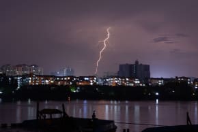 Bolts of lightning strike over Yangon on May 16, 2013. A cyclone slammed into the Bangladeshi coast on May 16 as a million people hunkered down in evacuation shelters, including in a region of Myanmar torn by communal unrest. 