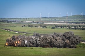 Smoke and fire rise from a controlled landmine explosion in northern Golan Heights, on the Syrian border, April 17, 2024; illustrative.