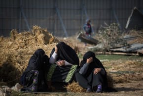 Bedouin women sit outside their demolished homes in the Bedouin village of Umm al-Hiran in the Negev desert, in the in the Southern Israel, January 18, 2017. 