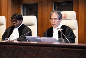International Court of Justice (ICJ) President Yuji Iwasawa (R) delivers a speech during a celebratory session marking the 80th anniversary of the ICJ in The Hague on April 17, 2026. 