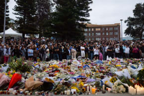 Community members gather outside of Bondi Pavilion at Bondi Beach, Sydney, following the deadly shooting on a Hanukkah party, Dec. 15, 2025.