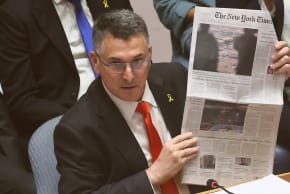 Israeli Foreign Minister Gideon Sa'ar holds up a copy of The New York Times as he speaks during a United Nations Security Council meeting at the United Nations headquarters on in New York City on August 5, 2025. 