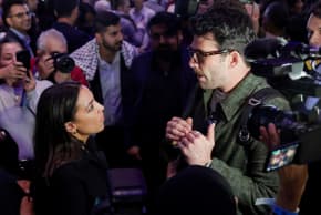 US Representative Alexandria Ocasio-Cortez (D-NY) and Hasan Piker speak as initial projections of Democratic candidate for New York City mayor Zohran Mamdani's win are declared during an election night rally in the Brooklyn borough of New York City, New York, US, November 4, 2025.