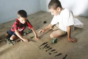 LEBANESE CHILDREN play with toy soldiers in the southern city of Bint Jbail.