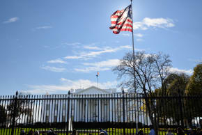 A large US flag flies outside the White House in Washington, DC on November 23, 2025.