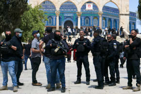 Israeli security personnel arrive as Muslim worshippers gather outside the Dome of the Rock within the Al-Aqsa Mosque compound for Friday noon prayers in the Old City of Jerusalem on April 10, 2026.