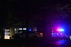 Tulsa police cars block the entrance of the Natalie Medical Building at Saint Francis Hospital campus in Tulsa, Oklahoma, on June 1, 2022. 