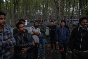 Migrants from Bangladesh stand in the woods near Velika Kladusa, Bosnia and Herzegovina, September 30, 2020. Hundreds of migrants from Asia, the Middle East and North Africa set up makeshift camps in Bosnian woods near the border with Croatia, attempting to cross into the European Union where they h