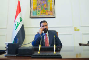 New Iraqi Prime Minister designate Ali al-Zaidi, uses a phone at his office in Baghdad, Iraq, April 28, 2026.